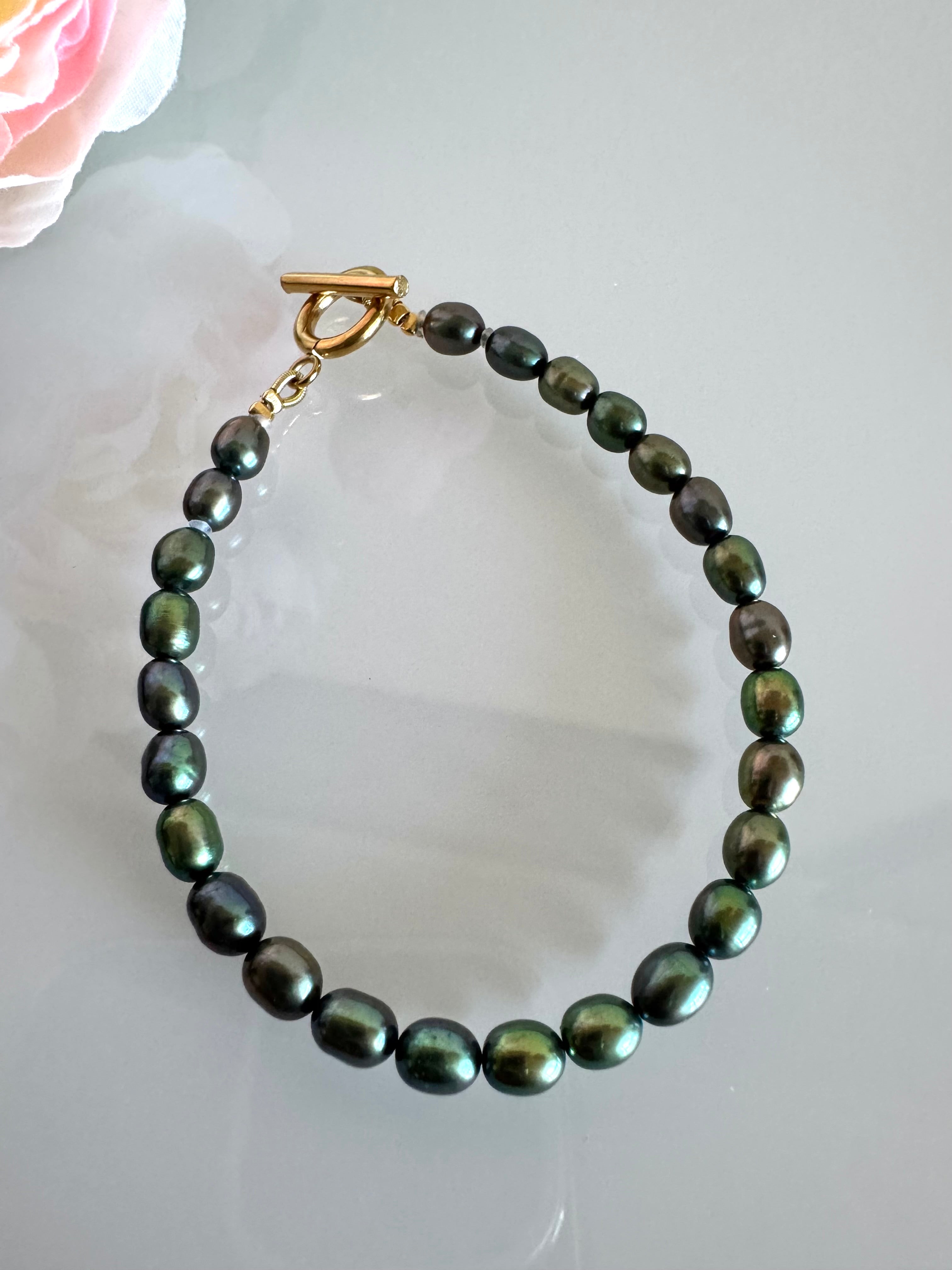Freshwater oval shape black pearl bracelet with surgical stainless gold clasps