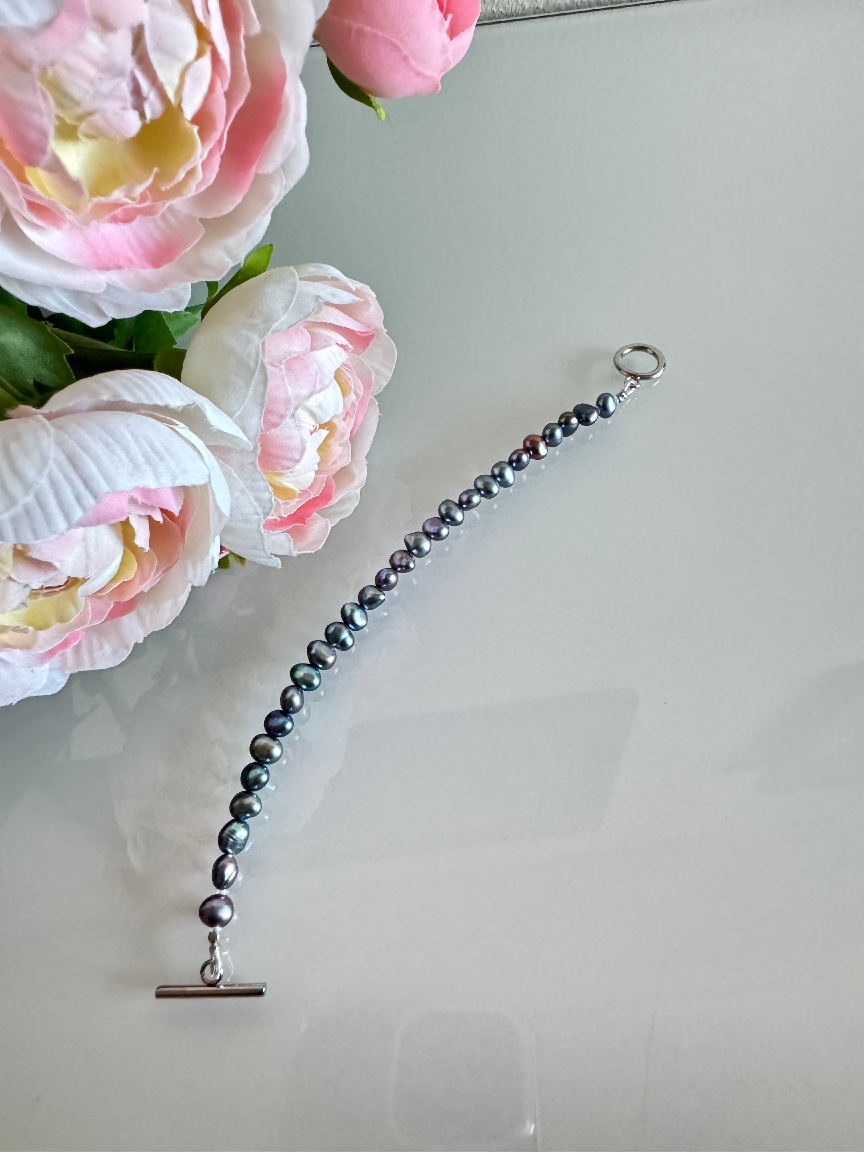 Freshwater black free form pearl bracelet with surgical stainless settings