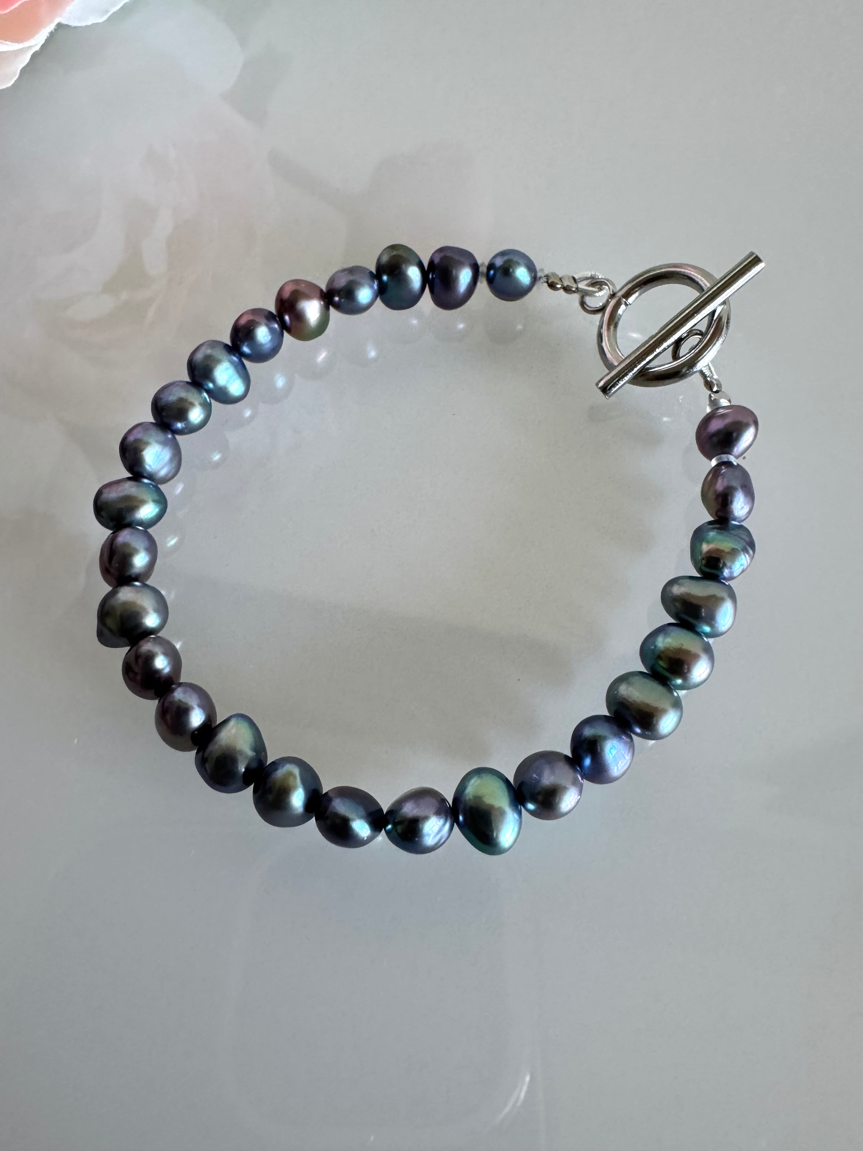 Freshwater black free form pearl bracelet with surgical stainless settings