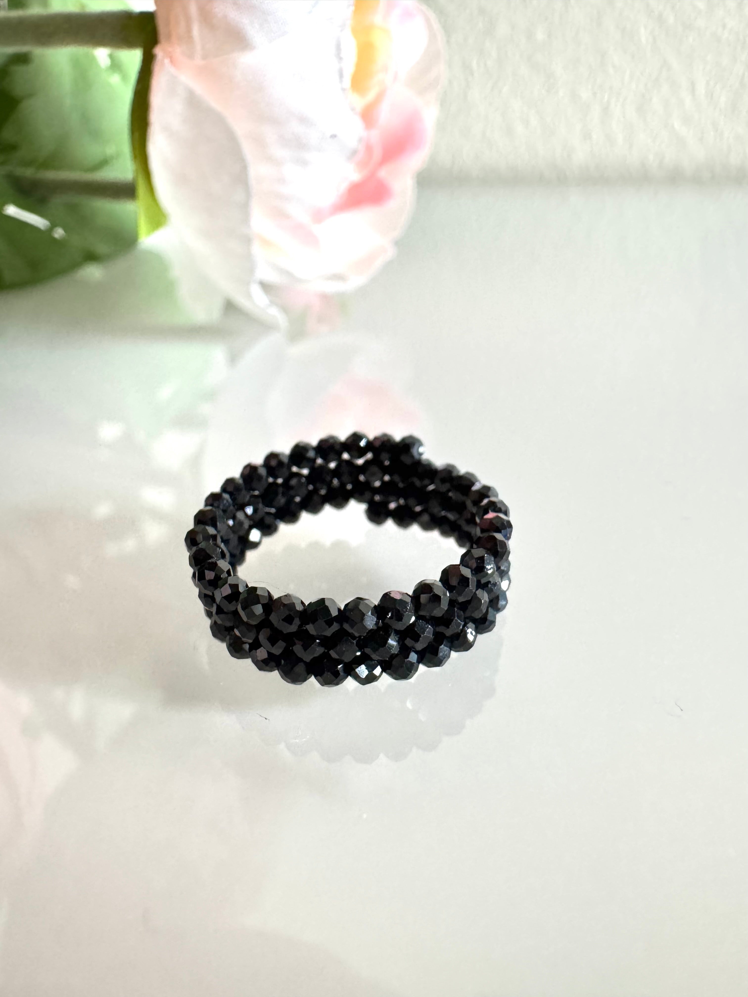 Black spinel (faceted) free size memory wire ring