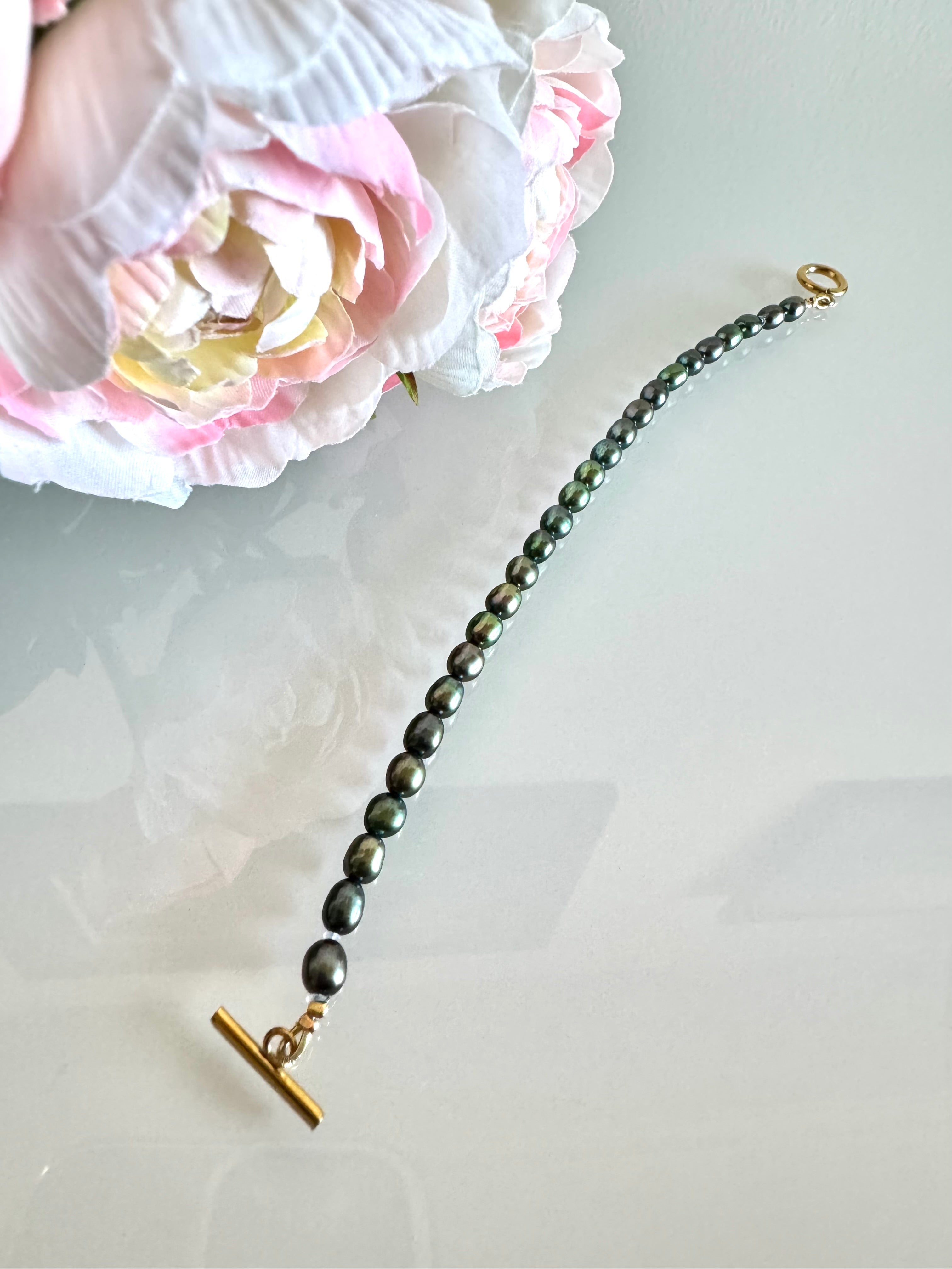 Freshwater oval shape black pearl bracelet with surgical stainless gold clasps