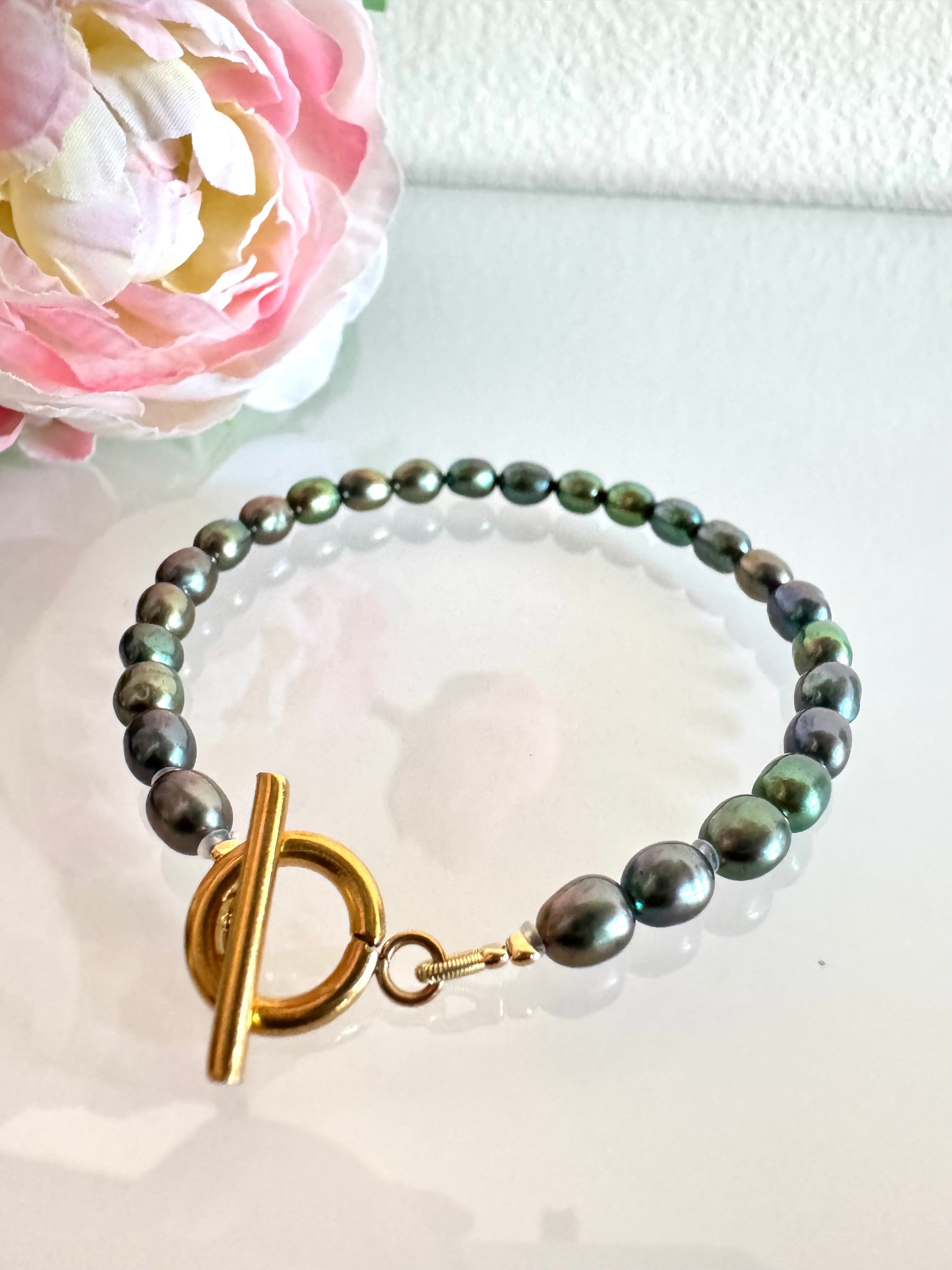 Freshwater oval shape black pearl bracelet with surgical stainless gold clasps